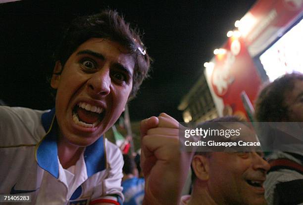 Italian football fans celebrate Italy's victory at the World Cup 2006 finals on July 9, 2006 in Milan, Italy. Italy defeated France at the World Cup...