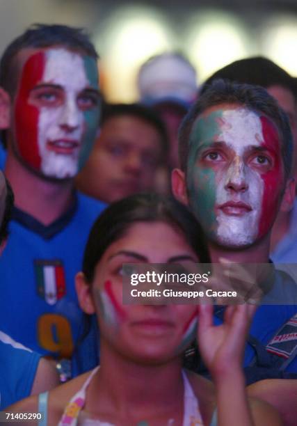 Italian football fans watch the World Cup Final at a public viewing area at the ''Piazza del Duomo'' on July 9, 2006 in MILAN, Italy. Italy defeated...