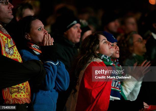 Italian football fans watch the World Cup final between Italy and France on a screen in Lygon Street July 10, 2006 in Melbourne, Australia