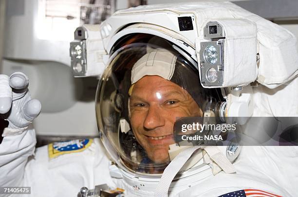 In this handout photo provided by NASA, astronaut Piers J. Sellers, STS-121 mission specialist, attired in his Extravehicular Mobility Unit...