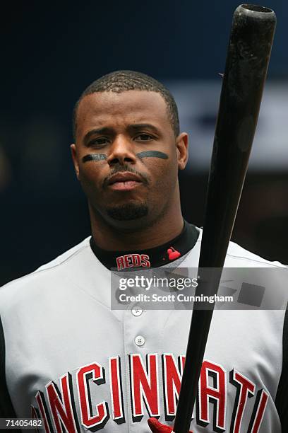 Ken Griffey Jr. #3 of the Cincinnati Reds grabs a bat to pinch-hit against the Atlanta Braves at Turner Field on July 9, 2006 in Atlanta, Georgia....