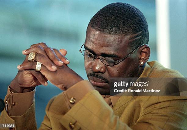 Michael Irvin of the Dallas Cowboys looks down during his Retirement Press Conference at Texas Stadium in Irving, Texas.Mandatory Credit: Ronald...