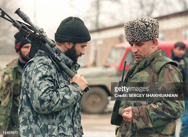 File picture taken 30 January 1996 shows Chechen field commander Shamil Bassayev as he speakes with the Chechen fighters' chief of staff Aslan...