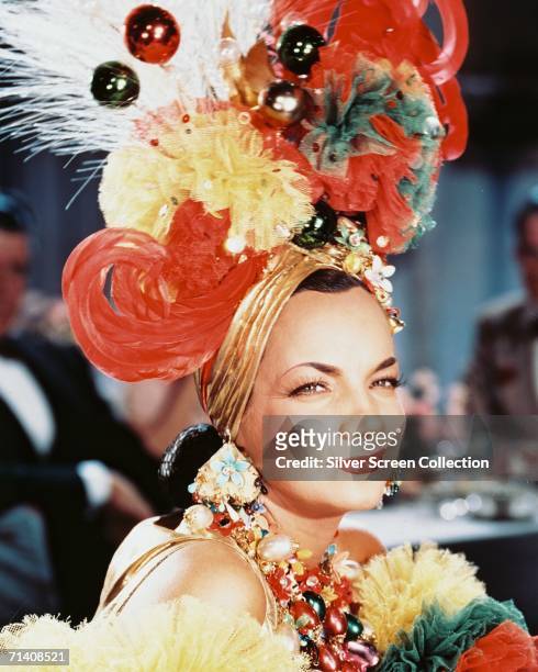 Portuguese actress and singer Carmen Miranda in one of her trademark extravagant headdresses, circa 1950.