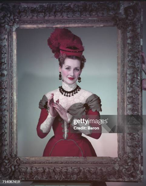 The Honourable Mrs Gerald Legge , later known as Comtesse de Chambrun, and Raine Spencer, Countess Spencer, wearing Edwardian period costume and...