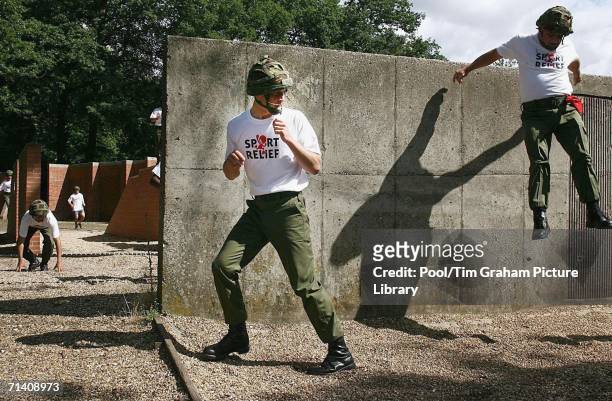 Prince William tackles an assault course during a Sport Relief charity mile run at Sandhurst Military Academy on July 8, 2006 in Surrey, England.
