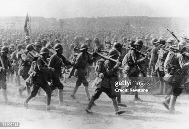 Communist troops of the Chinese Red Army on the march during the assault on Shanghai at the end of the Chinese Civil War, 21st May 1949.