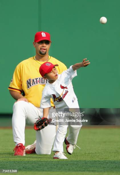 National League All-Star Albert Pujols of the St. Louis Cardinals and his son stand on the field before the CENTURY 21 Home Run Derby at PNC Park on...