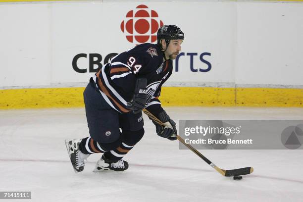 Ryan Smyth of the Edmonton Oilers looks to make a play to the net from the low slot against the Carolina Hurricanes during game three of the 2006 NHL...