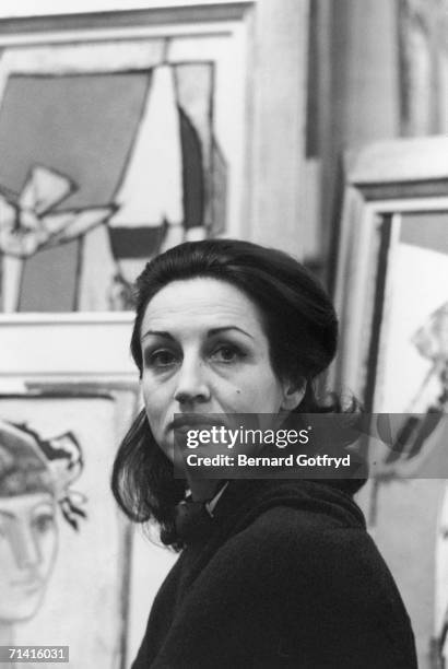 French painter Francoise Gilot Salk, mother of Paloma Picasso, poses for a portrait in a gallery surrounded by paintings, 1970s. Gilot married Dr....