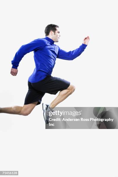 man jumping - running man profile stock pictures, royalty-free photos & images