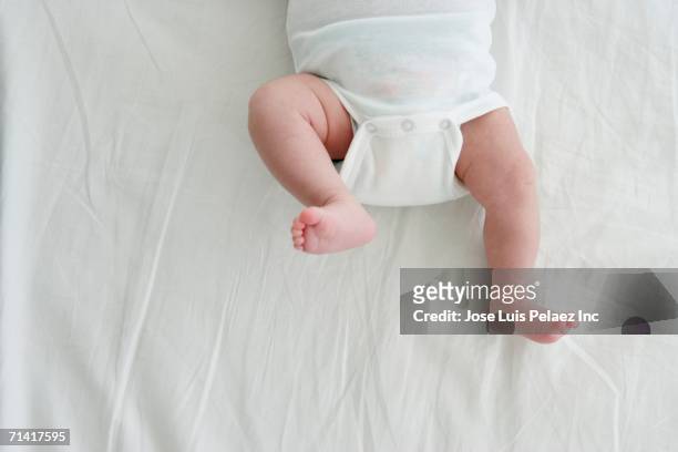 close up of baby's legs kicking - baby kicking stock pictures, royalty-free photos & images