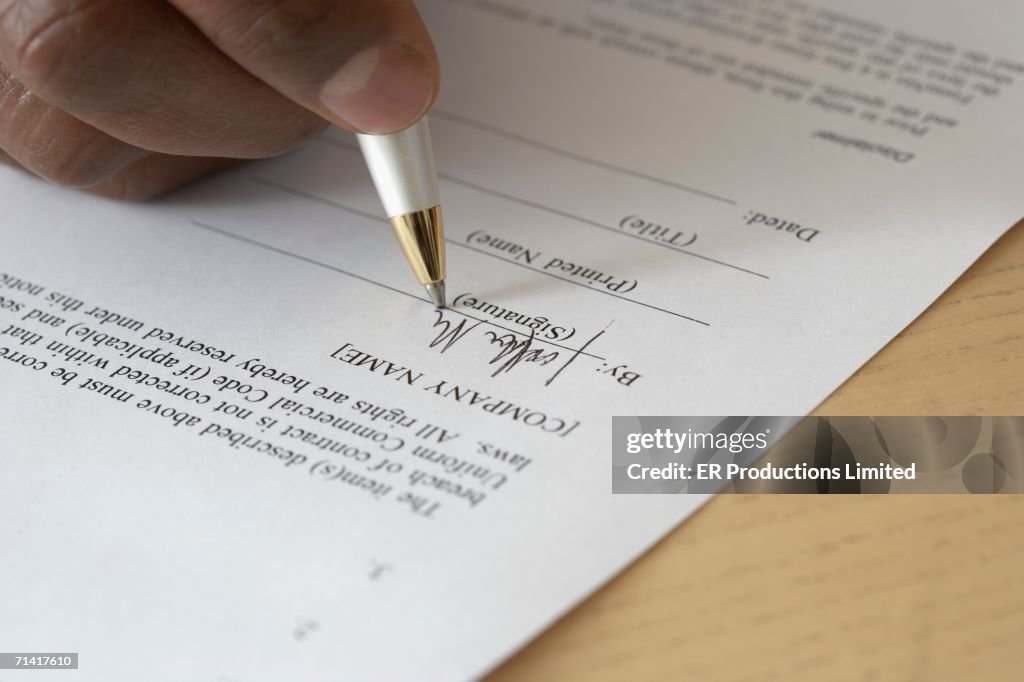 Close Up Of Mans Hand Filling Out Form High-Res Stock Photo - Getty Images