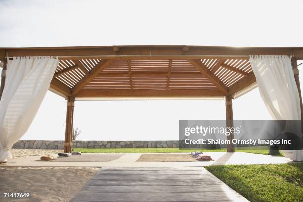 covered outdoor yoga area - pergola fotografías e imágenes de stock