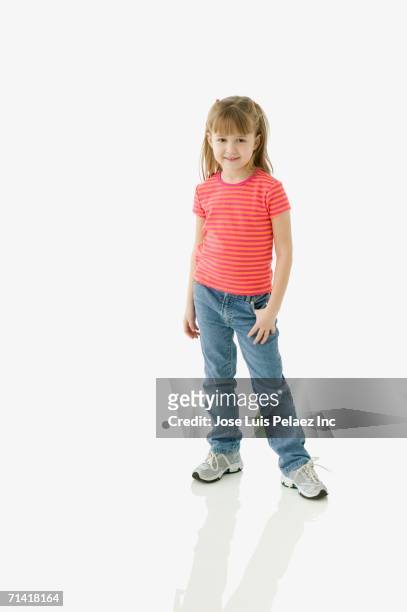 studio shot of young girl smiling - kids standing stock pictures, royalty-free photos & images