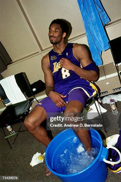 Kobe Bryant of the Los Angeles Lakers ices his ankle in the locker room after taking on the Indiana Pacers during Game Four of the 2000 NBA Finals...