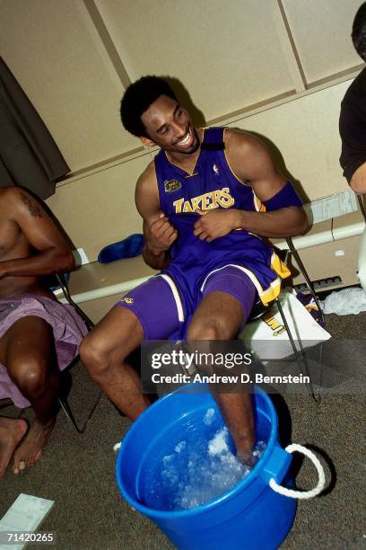 Kobe Bryant of the Los Angeles Lakers ices his ankle in the locker room after taking on the Indiana Pacers during Game Four of the 2000 NBA Finals...