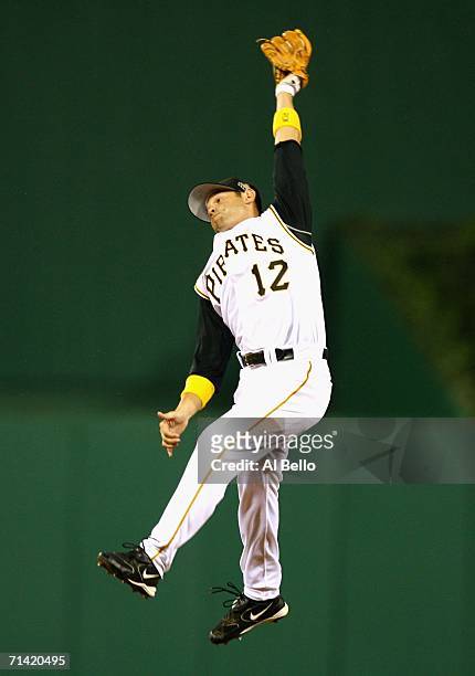 National League All-Star Freddy Sanchez of the Pittsburgh Pirates jumps to catch a ball hit by Mark Loretta of the Boston Red Sox during the 77th MLB...
