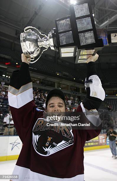 Jean-Francois Fortin of the Hershey Bears hoists the Calder Cup after the Hershey Bears defeated the Milwaukee Admirals in game six of the AHL Calder...