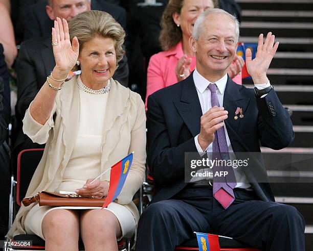 Mother and father of Crown Prince Alois, Marie of Liechtenstein and Prince Hans-Adam II of Liechtenstein wave to the crowd during the parade in Vaduz...
