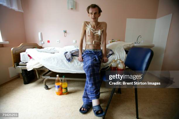 Dimitri a HIV positive drug user who has used drugs since he was 16 poses for a photo in his hospital bed on August 12, 2005 in Kiev, Ukraine. He is...