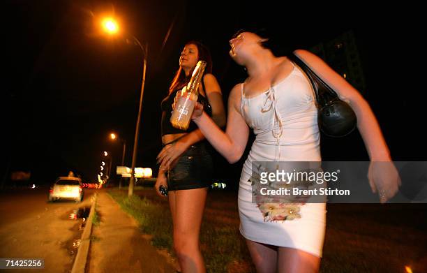 Sex workers on the ring road surrounding Kiev wait for roadside clients on August 12, 2005 in Kiev, Ukraine. These girls are the cheapest and most at...