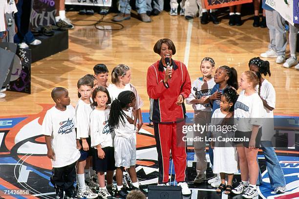 Singer Whitney Houston performs the national anthem at the 1999 WNBA All-Star Game played July 14, 1999 at Madison Square Garden in New York, New...