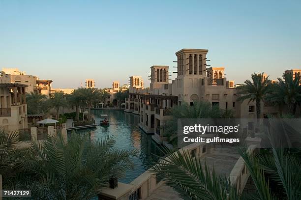 madinat jumeirah at day - madinat jumeirah hotel stock pictures, royalty-free photos & images