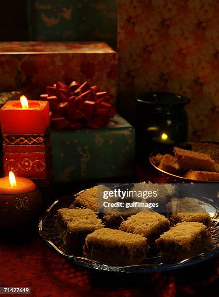 assorted arabic sweets - konafa, semolina cake, sesame seed brittle - konafa stock pictures, royalty-free photos & images