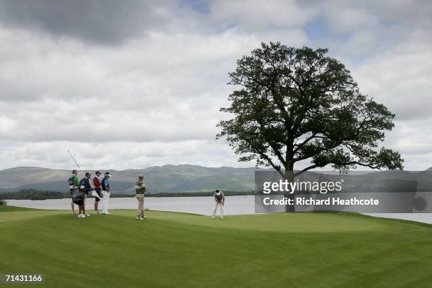 Gonzalo Fernandez-Castano of Spain holes a birdie putt on the 6th hole during the first round of The Barclays Scottish Open at Loch Lomond Golf Club...
