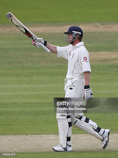England batsman Paul Collingwood raises his bat to acknowledge the applause after reaching his half century during the first day of the first npower...