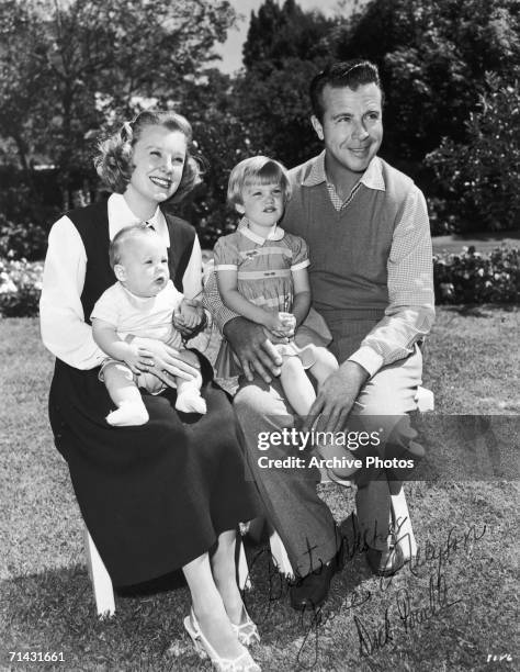 American actress June Allyson with her husband, actor Dick Powell , their baby son Dick Powell Jr, and Pamela Powell, Dick's daughter from his...