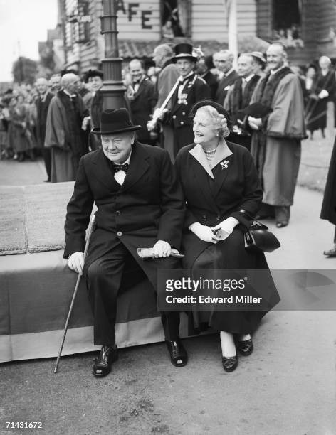 Former British Prime Minister Sir Winston Churchill with his wife Clementine at a civic parade in his Woodford constituency to mark the forthcoming...