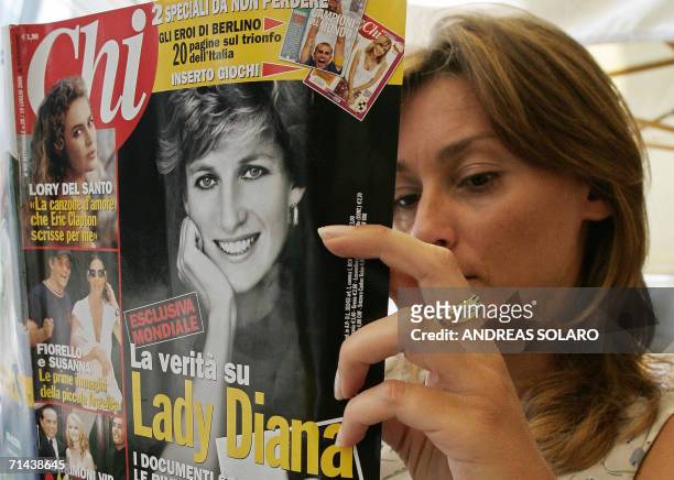 Women reads the Italian magazine Chi, which featured a photograph of Princess Diana as she lay dying, 14 July 2006 in Rome. Diana and her lover Dodi...