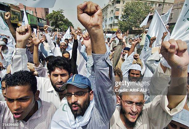 Activists of Pakistan's six-party Islamic alliance Muttahida Majlis-e-Amal chant slogans during a protest against Israeli air strikes on Lebanon and...