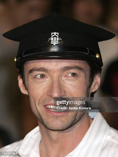 Actor Hugh Jackman poses for photographers during the premiere of the movie "X-Men: The Last Stand" at Waseda University on July 14, 2006 in Tokyo,...