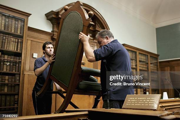 The Magistrate's chair is lifted out of court one by removal men at Bow Street Magistrates' Court on July 14, 2006 in London, England. The court,...