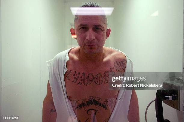 Carlos Ventura, shows off tattoos made on his body from a visiting cell in a maximum security prison on January 10, 2006 in Iowa Park, Texas. Ventura...