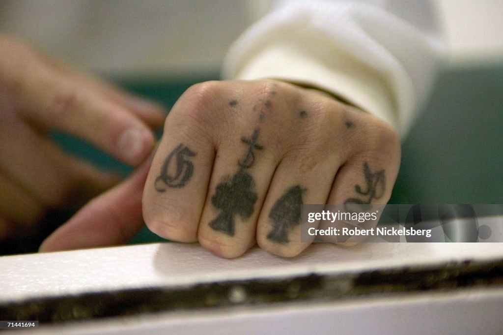 Daniel Flores, 24 years, shows off his altered gang tattoos from a... News  Photo - Getty Images