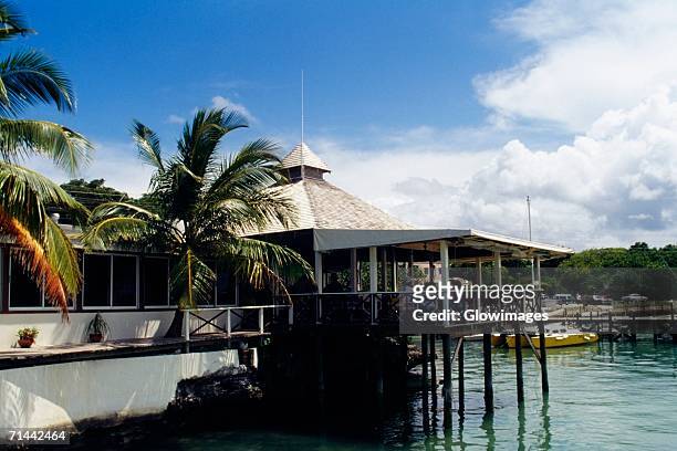 side view of a house on stilts, abaco, bahamas - abaco stock pictures, royalty-free photos & images