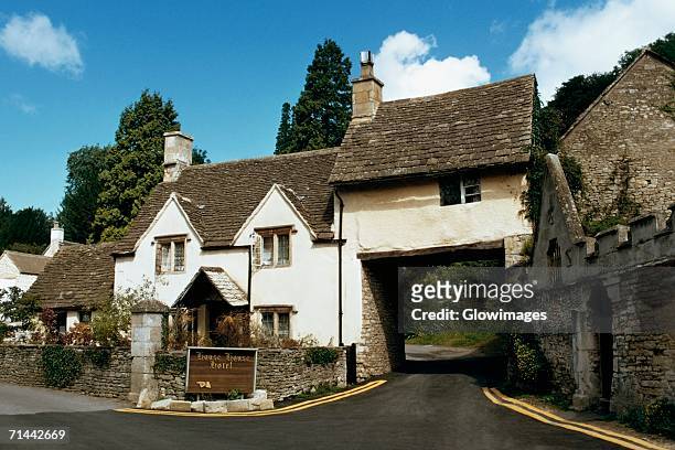 high angle view of a road leading to the entrance of a house, castle combe, england - castle combe stock pictures, royalty-free photos & images