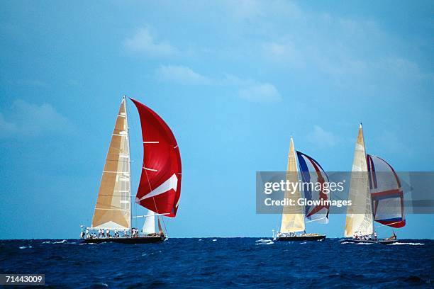 sailboats participate in the heiniken regatta on the dutch side of the island of st. maarten in the caribbean - isla de san martín fotografías e imágenes de stock