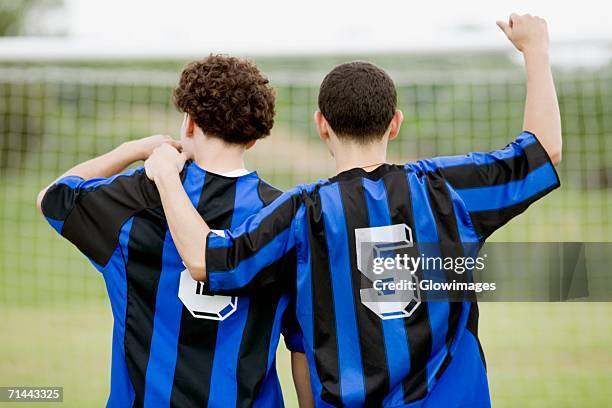 rear view of two soccer players - soccer jersey pattern stock pictures, royalty-free photos & images