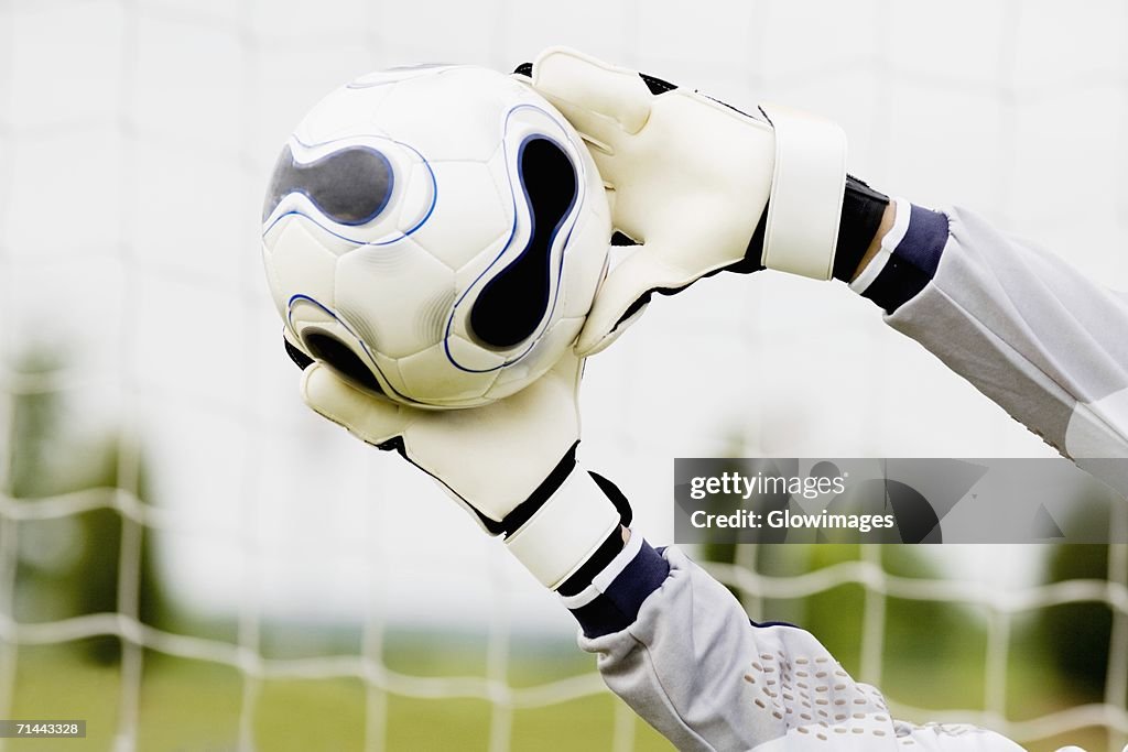 Close-up of a goalie's hands making a save
