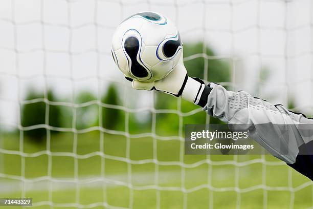close-up of a goalie's hand making a save - goalkeeper hand stock pictures, royalty-free photos & images