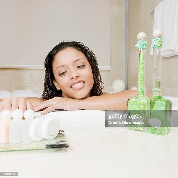 close-up of a teenage girl having bath - bubble bath bottle stock pictures, royalty-free photos & images