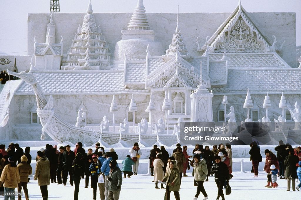 Tourist in front of a snow sculpture, Bangkok's Royal Palace, Snow Festival, Sapporo, Japan