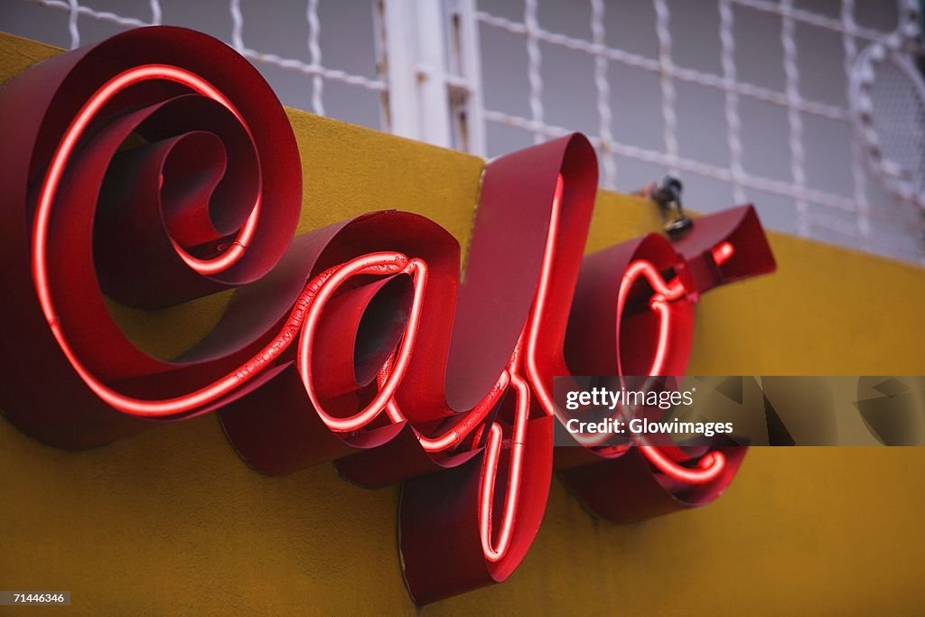 Low angle view of a store sign on a building wall