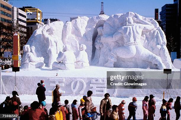 tourist walking in front of snow sculptures, snow festival, sapporo, japan - snow festival 個照片及圖片檔