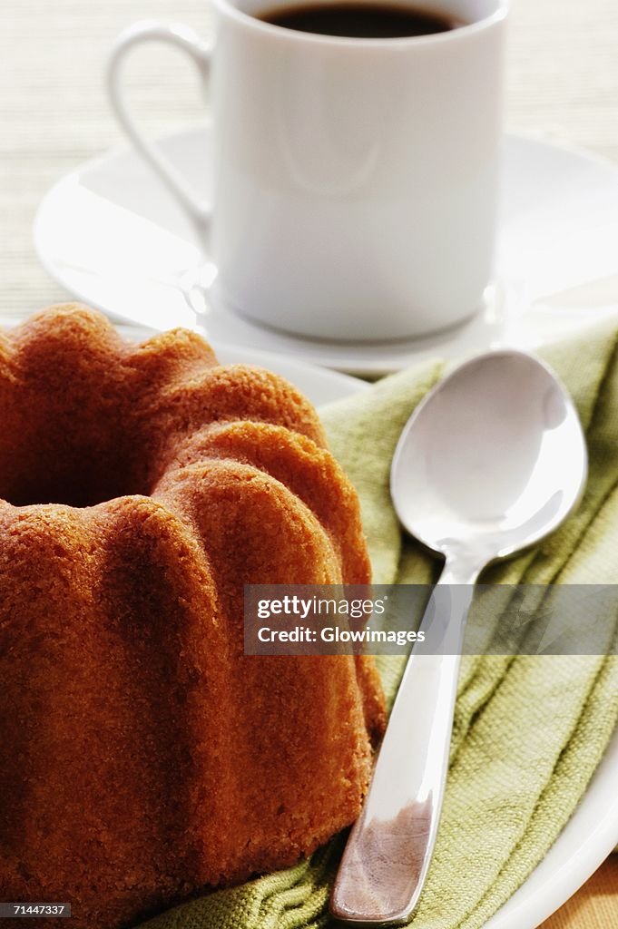 Close-up of a cake and a cup of coffee